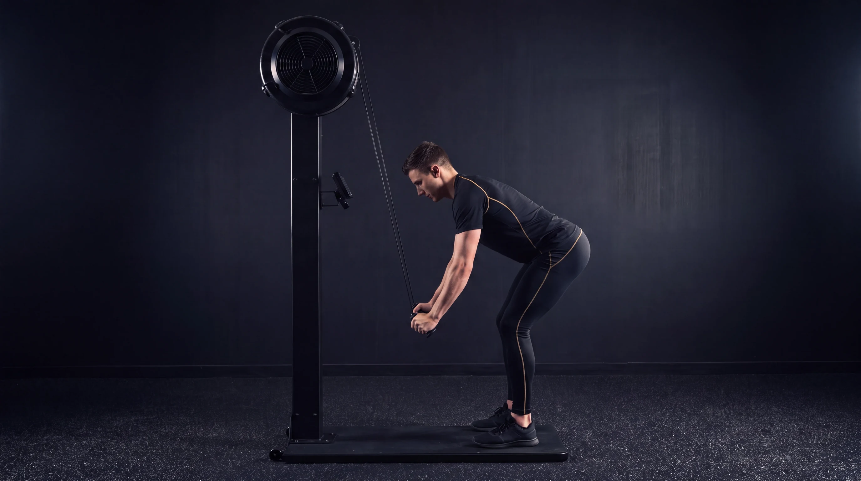 Side view of a SkiErg hip hinge with the hands finishing past the hips